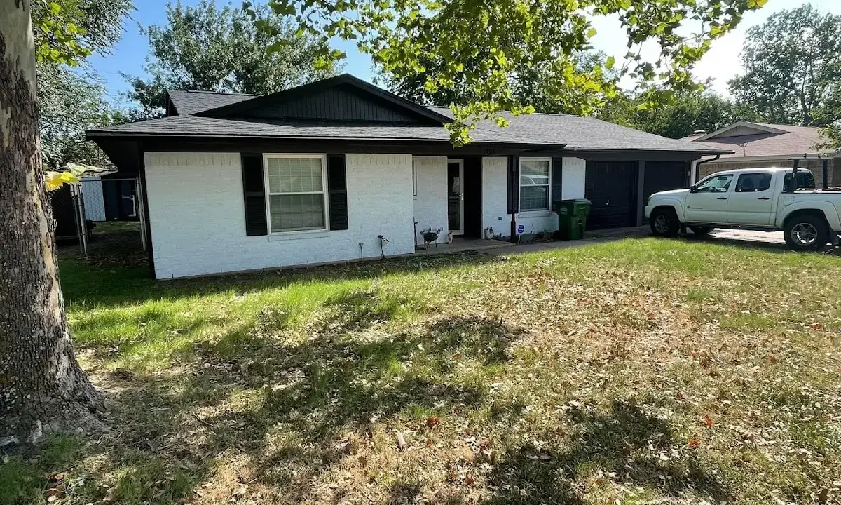 Professional roofing crew working on a residential roof in Edgewater